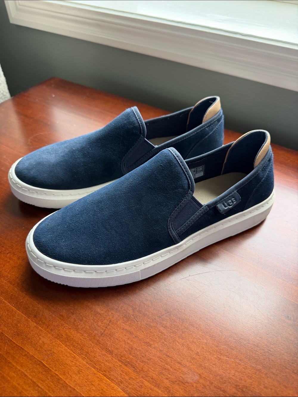 UGG Women’s 9.5 Navy Suede Slip-On Loafers with White Sole
